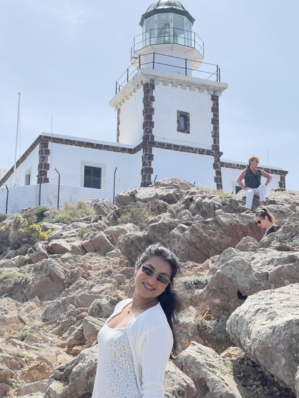 Figure 2: Posing in front of the Lighthouse, Santorini